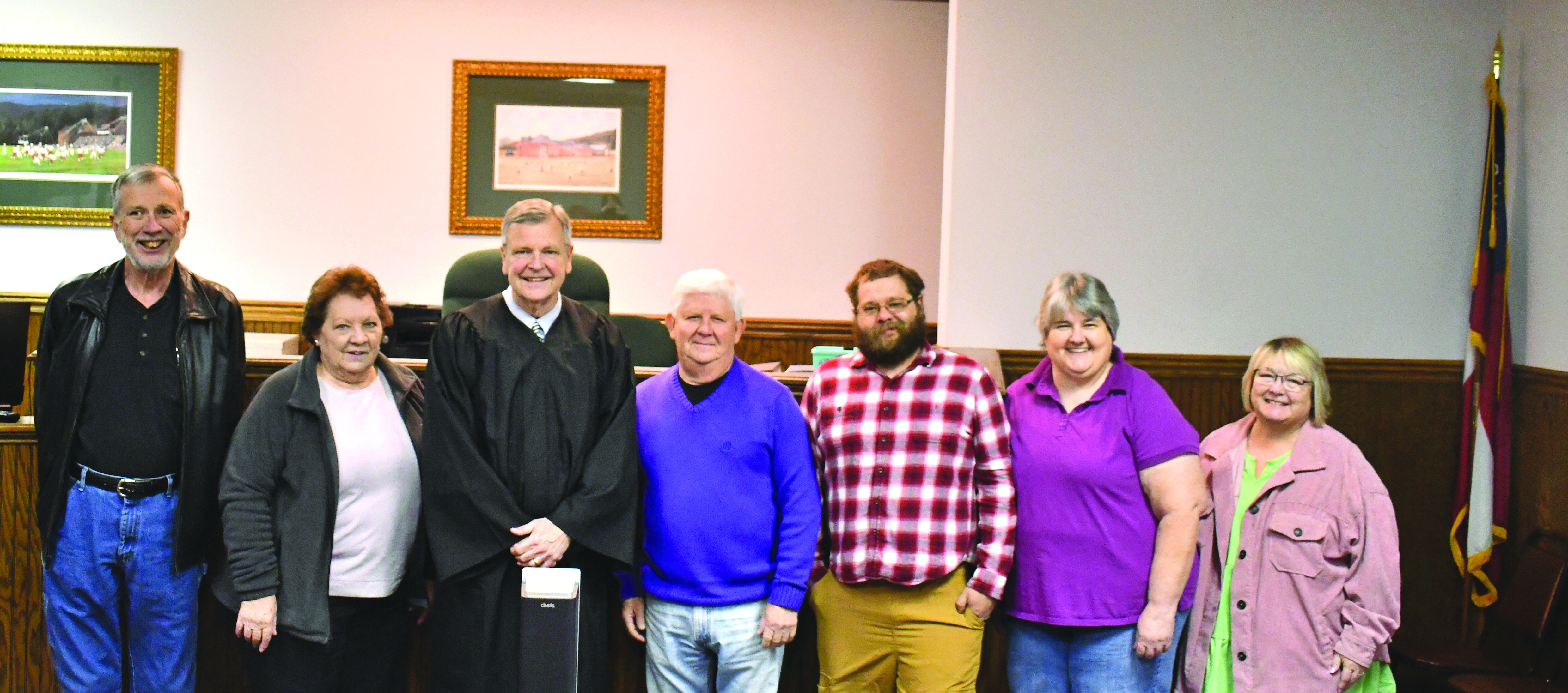 Megan Horn/The Clayton Tribune. Probate Judge Carlton Hobie Jones, III swears in Rabun County Election Board members and officials in the Probate Courtroom Wednesday morning. Pictured are Chairman Roy Lovell; Liz Dixon; Jones; Jimmy Bleckley; Deputy Registrar Derik Pendrey; Elections and Voter Registration Director Tammy Whitmire; and Deputy Registrar Lynne Ramey. 