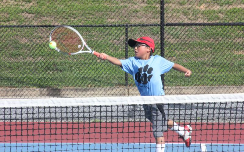 Jack Getty extends to return a ball during a singles match at Rabun County High School’s tennis courts in Tiger on Tuesday. (Photo by Glendon Poe/The Clayton Tribune)