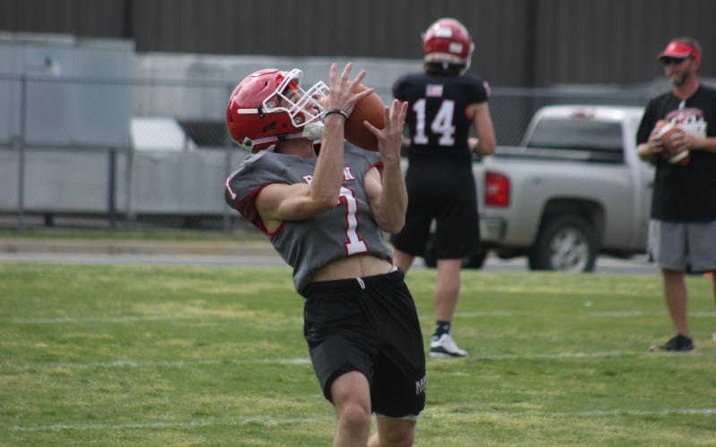 Rabun County running back Langdon Windham catches a pass during warm-ups at the team’s practice field in May. (Glendon Poe/The Clayton Tribune)
