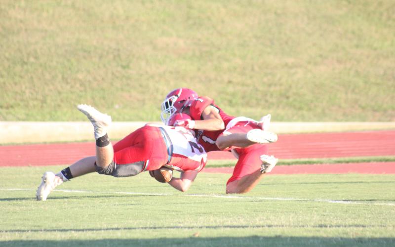Rabun County’s Dawson Lathan (1) tackles a Franklin (N.C.) player in the end zone during the first quarter of a preseason game at Frank Snyder Memorial Stadium in Tiger last Friday night. The play resulted in a safety. (Glendon Poe/The Clayton Tribune)