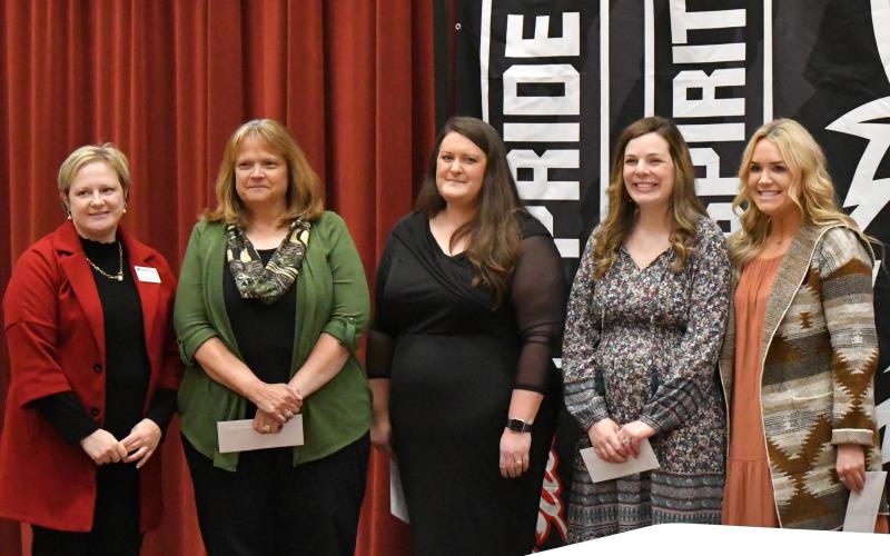 Enoch Autry/The Clayton Tribune. Habersham EMC Diretor of Strategy and Communications Nicole Dover (far left) awarded the banquet honorees with gifts. The honorees were Rabun County Primary School teacher Sharon Lampros; elementary school teacher and system teacher of the year Natasha Mazarky; middle school teacher Emily Lovelady; and high school teacher Hannah Miller.