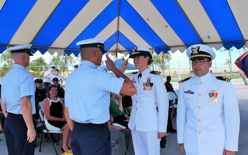 Photo courtesy of Sarah Ernst. Sarah Ernst (center) receives the Change of Command for a 2016 ceremony for the CGC ASSATEAGUE. Retired Coast Guard officer Ernst now is in the reserves and the Terra Incognita Vineyard event planner on the Clarkesville property.
