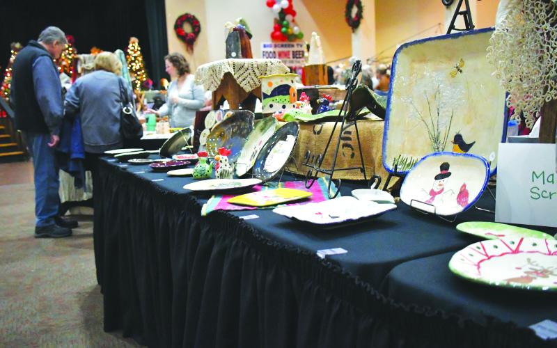 Luke Morey/The Clayton Tribune. At the civic center, Marcia Scroggs of L.A. Arts displayed her hand-crafted pottery as the plates were made without a wheel.