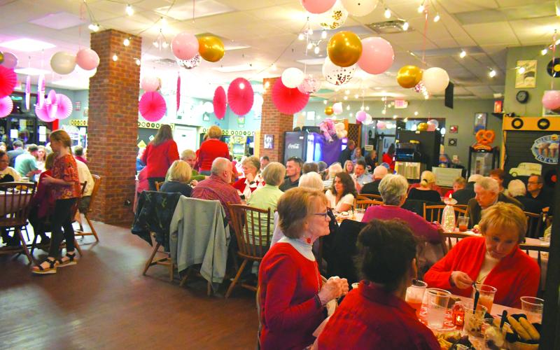 Megan Broome/The Clayton Tribune. Nearly 200 people made their way to The Soda Fountain Restaurant and Catering in Clayton on Valentine’s Day as the business served up a side of love for the local nonprofit Place of Hope North Georgia with an Italian Buffet fundraising event. 