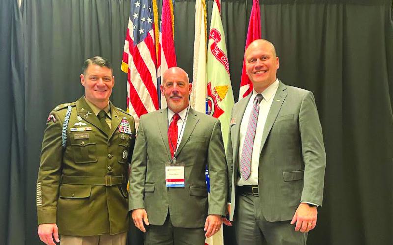 Photo courtesy Roger Glenn. Roger Glenn (center) stands with Lt. Col. Michael Kelvington, professor of military science, and Doug Huber, the current president of The Ohio State Army ROTC Alumni Society, at Glenn’s induction ceremony into the university’s ROTC hall of fame.