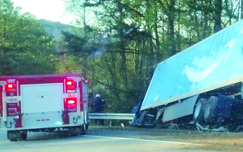 Photo courtesy of Conner Horn. Emergency personnel work the scene of a single vehicle crash involving a semi-truck with an Amazon Prime logo on Ga. 15 just south of McKay Road in Lakemont Monday, April 10. The southbound lane was shut down for a short time as personnel worked the scene. 
