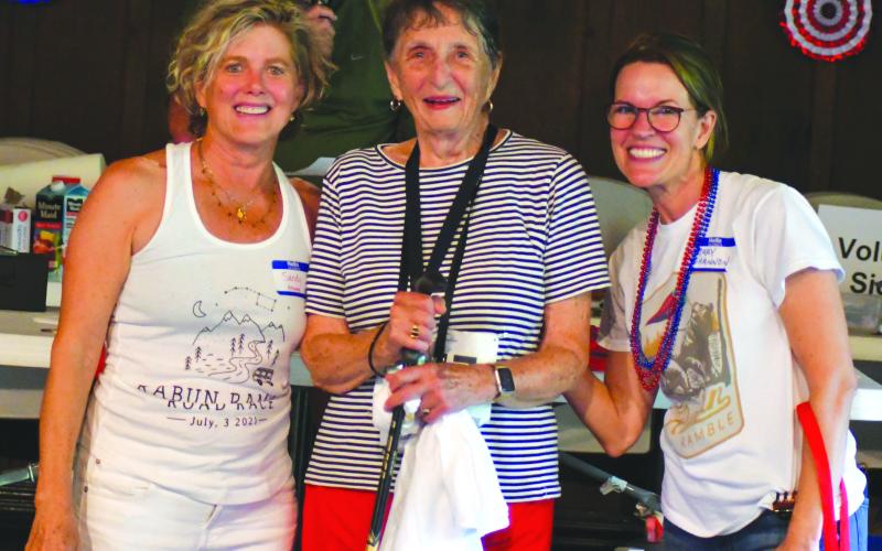 Enoch Autry/The Clayton Tribune. Sandy Strong and Mary Shannon Scott congratulate 87-year-old Mary DeBorde for walking the 5K at the Rabun Ramble. Strong is the founder of the Rabun Ramble and Scott is the event organizer. A total of 589 participated in this year’s 5K. Additionally, 150 participated in the Rabun Ramble’s 10K. The money annually raised goes to support the Lake Rabun Foundation as it gives back to the community.