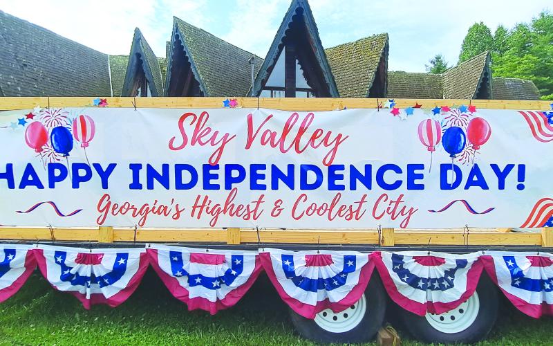 Megan Broome/The Clayton Tribune. The sign says it all: Happy Independence Day from the City of Sky Valley!  