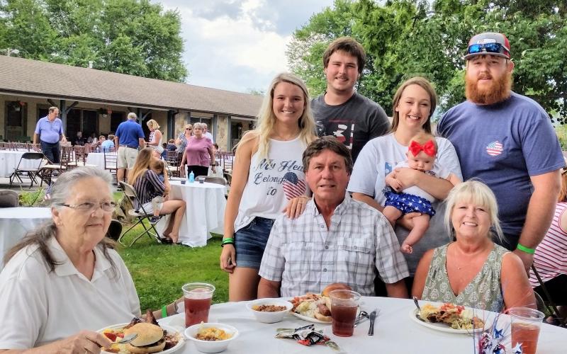 Megan Broome/The Clayton Tribune. The Dillard House had a record turnout with over 500 people on July 4. Enjoying a cookout on the Oaklawn are the Phillips family, who are Rabun County residents. Pictured front row: Jean; David; Brenda; back row: Calin; Elgan; Savannah; Eva, 2-months-old; and Christopher Phillips. 