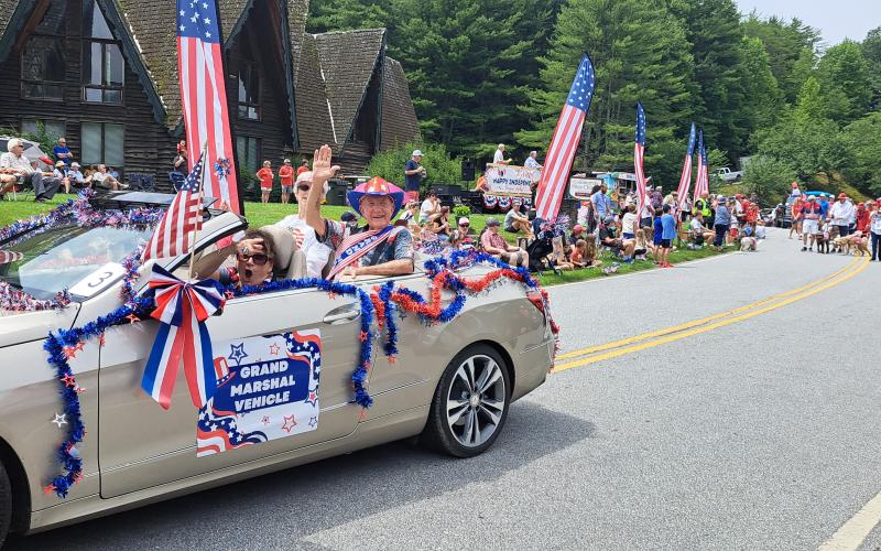 Megan Broome/The Clayton Tribune. Mitt and Anne Gillespie were the parade Grand Marshals. Dee Vollmer is driving.