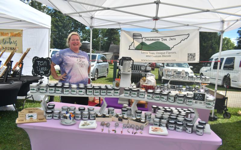Megan Broome/The Clayton Tribune. Jackie Muse showcased Tennessee Tea Jars during the 26th Dillard Bluegrass Festival last weekend. Not pictured is Kappy of Tennessee Tea Jars.