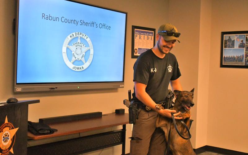 Megan Horn/The Clayton Tribune. K9 Deputy Jorka is officially retired after six years of honorable service at the Rabun County Sheriff’s office. She is 8-years-old and pictured with partner Cpl. Clinton Scott at her retirement reception held Sept. 8. 