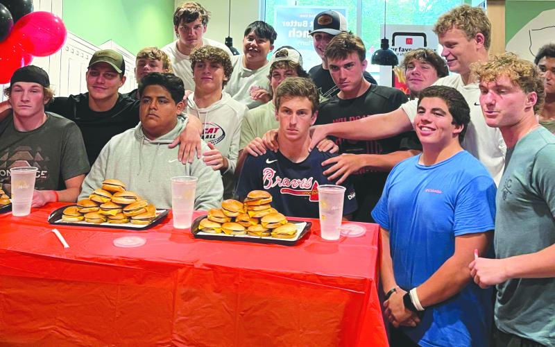 Submitted.  Rabun County Wildcats pose with their football teammates Alex Yearwood, Rueben Fuentes and Carver Jarrard before the start of the cheeseburger eating contest. 