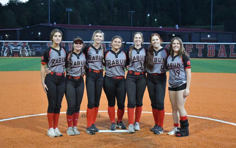 Wade Cheek/The Clayton Tribune. Rabun County Lady Cat senior softball players Alexis Hopper, Mili Watts, Christina Keller, Brooklyn Ramey, Icie Green, Savannah Sanchez and Ava Rowe were honored after the Oct. 9 game against Chestatee. The Lady Cats won the game 13-1. The RCHS girls now head into the state playoffs.