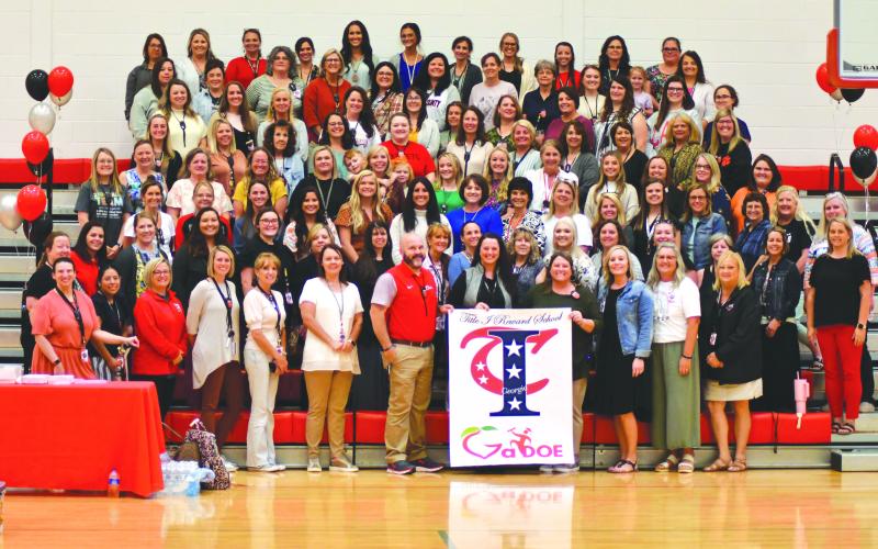 Enoch Autry/The Clayton Tribune. Rabun County Primary School teachers and elementary school third grade teachers celebrate RCPS being named a new Title I Rewards School. The announcement was made at RCPS Tuesday afternoon.
