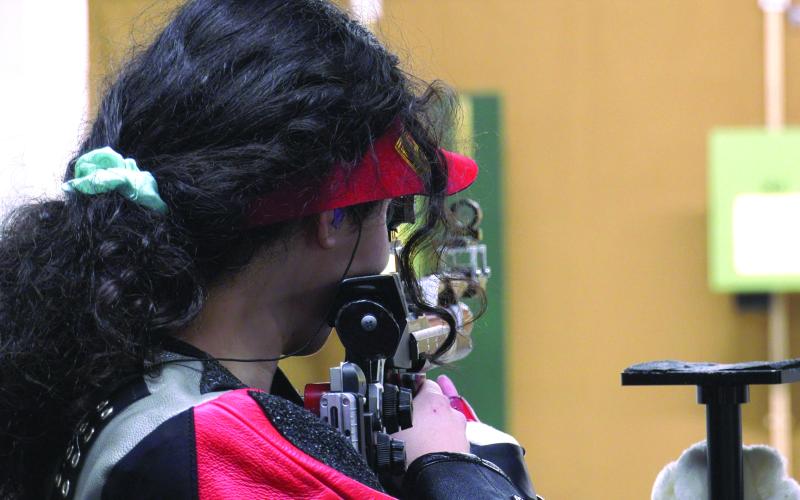 TFS Athletics. TFS marksman and Junior Olympic Qualifier Brianna Walter lines up a shot during the GHSA semifinals against Kendrick on Feb. 29. 