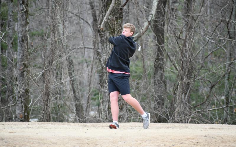 Wade Cheek/The Clayton Tribune. RCHS senior Jack Hood drives off the tee at Kingwood Resort during the Wildcat golf team's match against Dawson County on Feb. 29. Hood shot a 38 to help RCHS win 176-186.