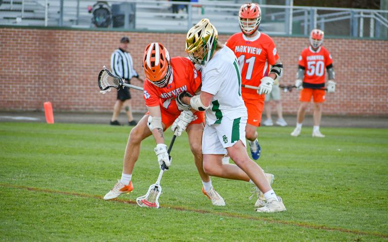 Wade Cheek/The Clayton Tribune. RGNS senior Jack Moores applies defensive pressure on Parkview High School during a March 28 game against the Panthers. The Eagles shut the Panthers out 16-0 to move to 7-1 on the season.