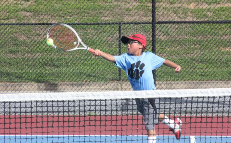 Jack Getty extends to return a ball during a singles match at Rabun County High School’s tennis courts in Tiger on Tuesday. (Photo by Glendon Poe/The Clayton Tribune)
