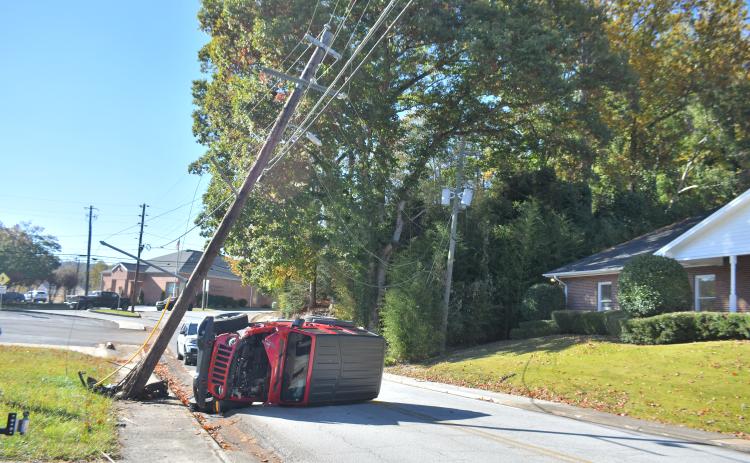 Megan Broome/The Clayton Tribune. A Georgia Power utility power pole was taken out on Hiawassee Street after it was struck by a red 2018 Jeep Wrangler Unlimited Oct. 14. The single vehicle crash resulted in no injuries, but the road was closed for a period of time following the crash. 