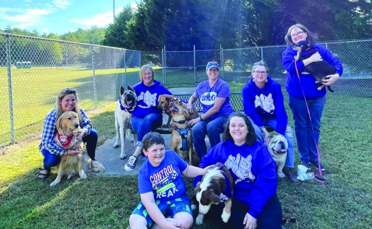 Submitted photos. From left, Allison Fish & Peaches; Carmen Rose & Loki; Mary Simonson with Sally & Blue; Bettina Justice & Hank; Holly Williamson & Lula; and Colton and Danielle Shetters with Oakey take a moment at the Rabun County Bark Park on Oct. 8 at the Shade-OutDM event.