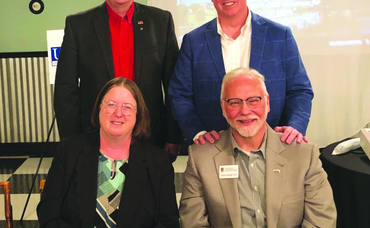 Tony Penrose/The Clayton Tribune. Pictured front are Ryder, left, and Fulbright. Back row are Mickey Duvall, business and economic development strategist for Forward Rabun, Inc.; and Rick Story, president of the Rabun County Chamber of Commerce. 