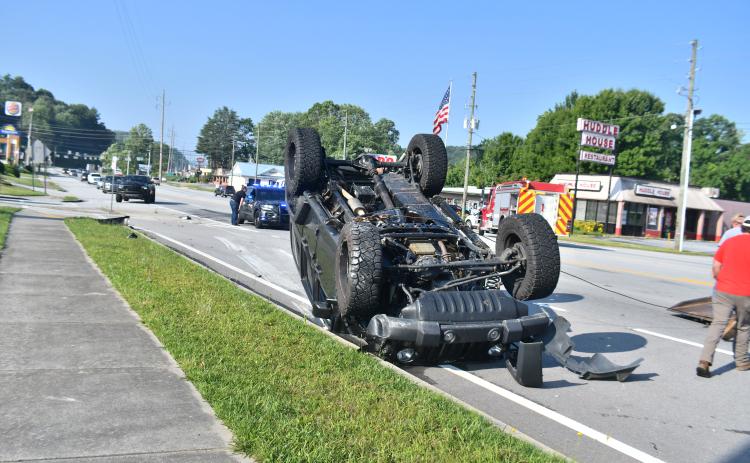 Megan Broome/The Clayton Tribune. First responders work the scene of a two-vehicle crash at Ingles Wednesday morning. Minor injuries were reported and a Sylva, N.C., man faces traffic charges.