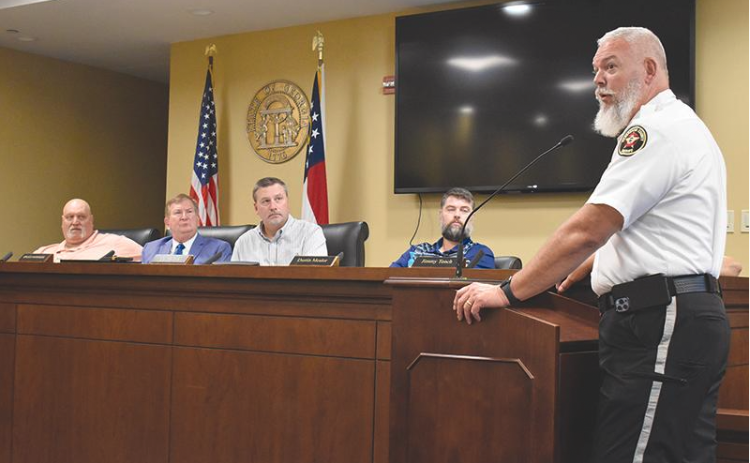 Matthew Osborne/The Northeast Georgian. Sheriff Joey Terrell (right) told Habersham County commissioners recently that he means business when it comes to making Highway 365 safer.