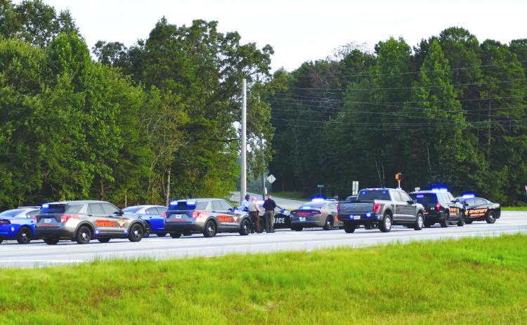 Enoch Autry/The Clayton Tribune. Patrol cars from multiple law enforcement agencies line U.S. 441 in Habersham County where a Louisiana man was taken into custody after a multi-county chase that started in Rabun on Aug. 21.