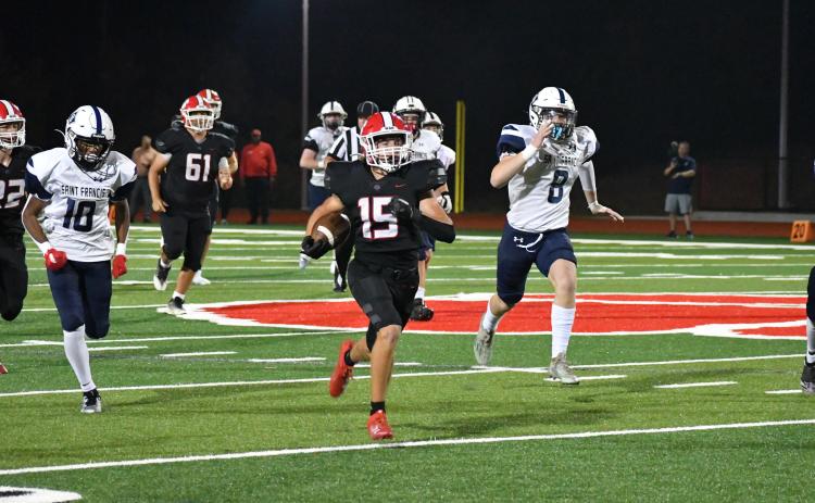 Wade Cheek/The Clayton Tribune. Rabun County sophomore running back Reid Giles races 72 yards to the end zone for the Wildcats final touchdown of their 49-13 victory last Friday over St. Francis. RCHS plays region foe Elbert County Friday.
