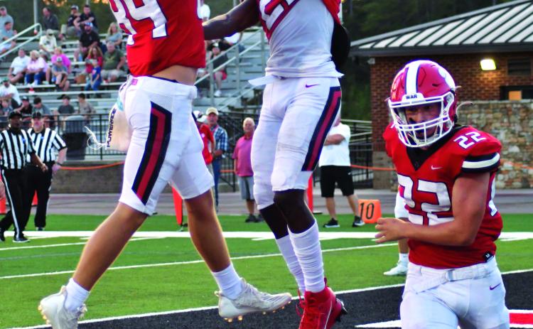 Enoch Autry/The Clayton Tribune. University of Cincinnati commit and senior Wildcat Willie Goodwyn (23) celebrates after a TD with Rabun County teammates Jake Payne and Carver Jarrard. Goodwyn was the region “Athlete of the Year”, Payne earned a spot on the Class A Division I Region 8 second team while Jarrard was an honorable mention. 