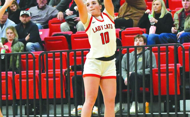 Wade Cheek/The Clayton Tribune. Lady Cat senior guard Mili Watts laces a three-pointer in Rabun County’s 75-53 victory over Franklin on Nov. 28. The Panthers evened the season series at one after getting revenge over the Lady Cats on Tuesday, Dec. 5, winning 73-58. 