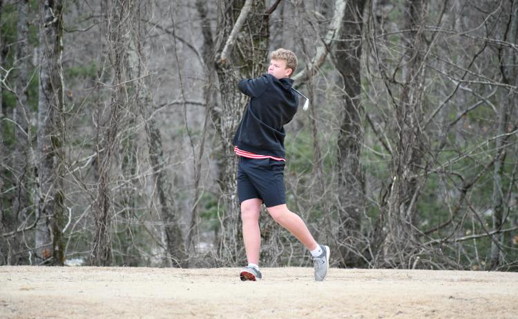 Wade Cheek/The Clayton Tribune. RCHS senior Jack Hood drives off the tee at Kingwood Resort during the Wildcat golf team's match against Dawson County on Feb. 29. Hood shot a 38 to help RCHS win 176-186.