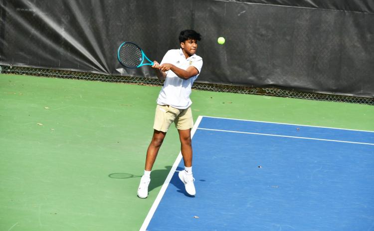 Wade Cheek/The Clayton Tribune. RGNS tennis player Om Patel returns a serve from his Asheville School opponent during a conference match on Thursday, March 21. As of Tuesday, March 26, the Eagles are 3-1 in the 2024 season. 