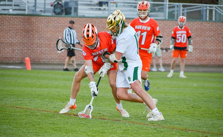 Wade Cheek/The Clayton Tribune. RGNS senior Jack Moores applies defensive pressure on Parkview High School during a March 28 game against the Panthers. The Eagles shut the Panthers out 16-0 to move to 7-1 on the season.