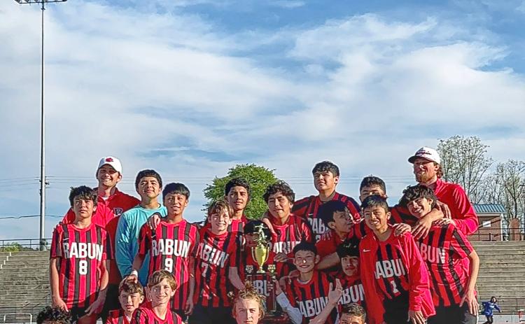 Submitted. The RCMS boys soccer team poses with their first-ever region title trophy, which they won after a 4-2 win over Hart County in the title game on Saturday, March 23. The 12-3 Wildcats are coached by head coach Brett Bardenwerper and Cody Harris. 