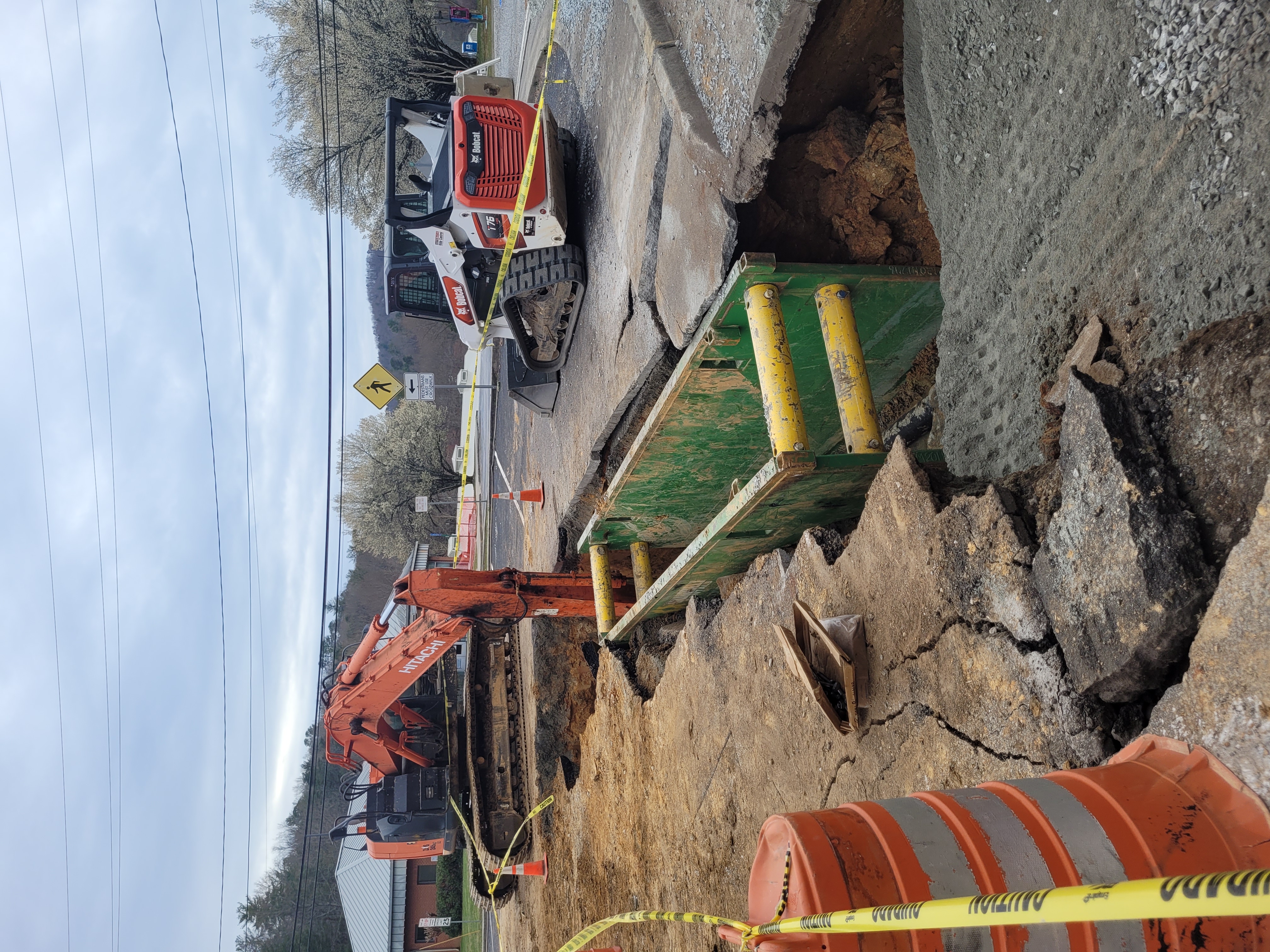 Megan Broome/The Clayton Tribune. Hiawassee Street in Clayton is closed for replacement of a damaged or collapsed pipe. Crews are working to have the road open up this week. 