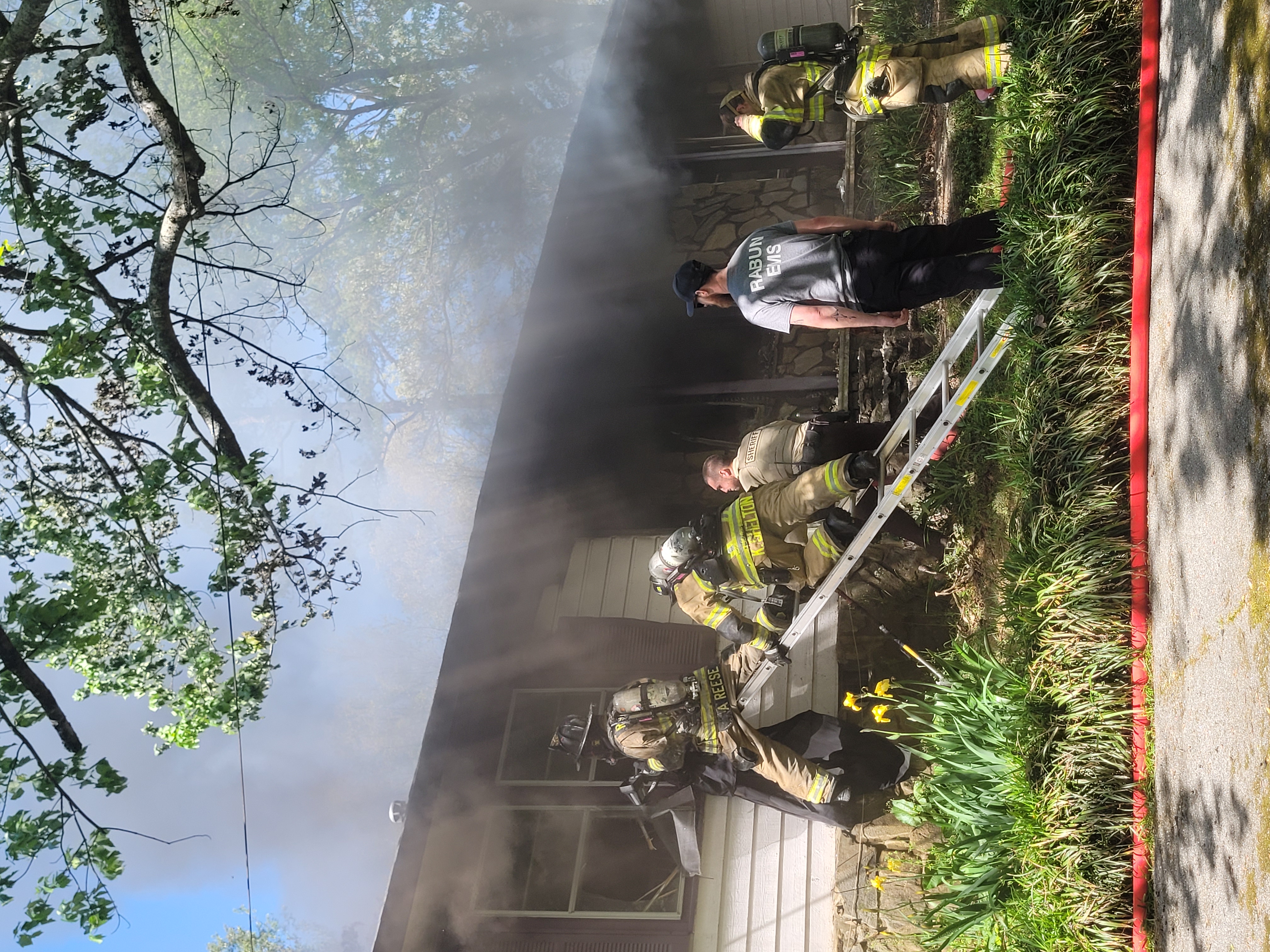 Megan Broome/The Clayton Tribune. Rabun County Fire Services and other emergency personnel work the scene of a structure fire on Stekoa Falls Rd. in Clayton.  No injuries were reported. 