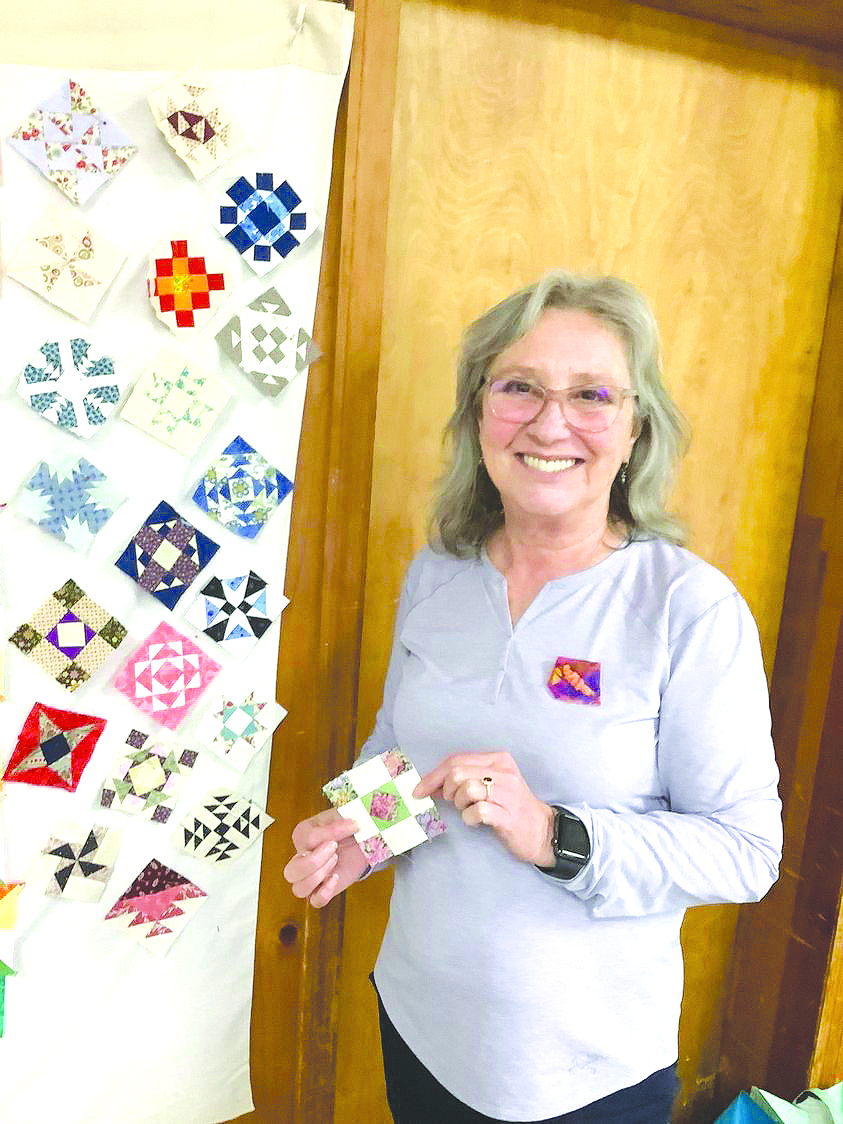 Submitted photo. Barbara Westbrook displays one of the patches used by the Mountain Laurel Quilters’ Guild.