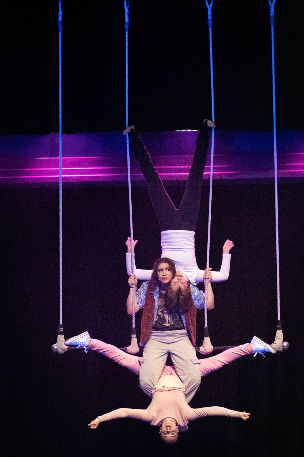 Photo courtesy Megan Morris/Rabun Gap-Nachoochee School. Jennica Ullrich’23 of Knoxville, Tenn., Brooksie Tate Martin '23 of Clayton, and Elizabeth Brenner ’24 of Franklin, N.C., perform on the triple trapeze in Cirque Fantôme at Rabun Gap-Nacoochee School. 