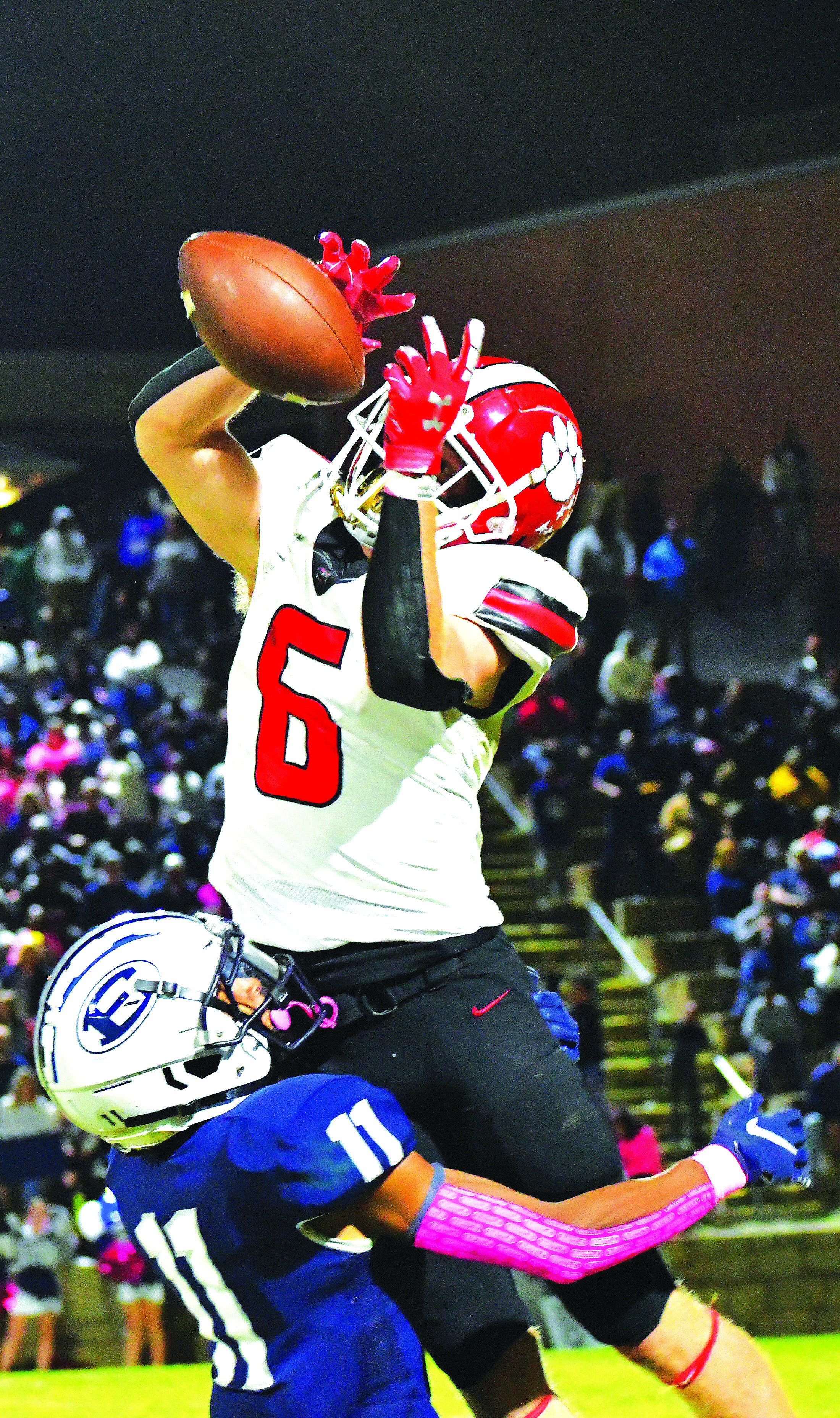 Luke Morey/The Clayton Tribune. Gibson hauls in a catch against Elbert County defender Christian Harris.