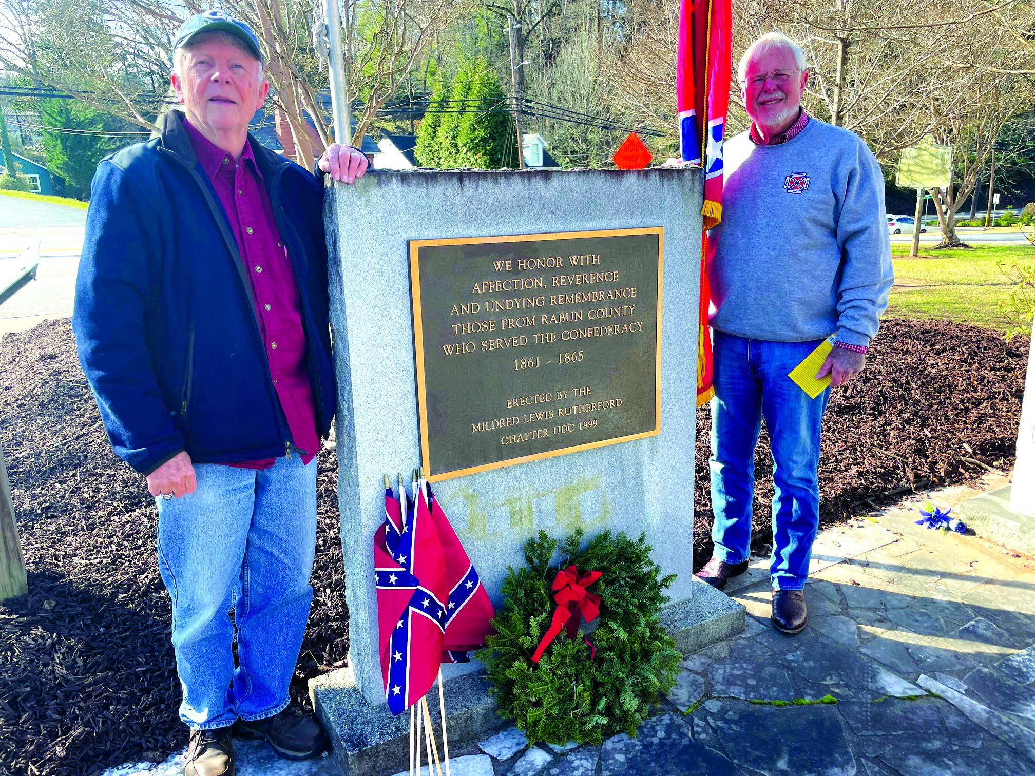 Submitted photo.  Commander Robert Williams (right) and Dywane Dotson, Sons of Confederate Veterans, Camp 1929 (The Rabun Gap Riflemen) honor and present a Christmas Wreath & Prayer for the 193 Confederate soldiers buried in Rabun County. Visit www.rabunscv.org for more information. 