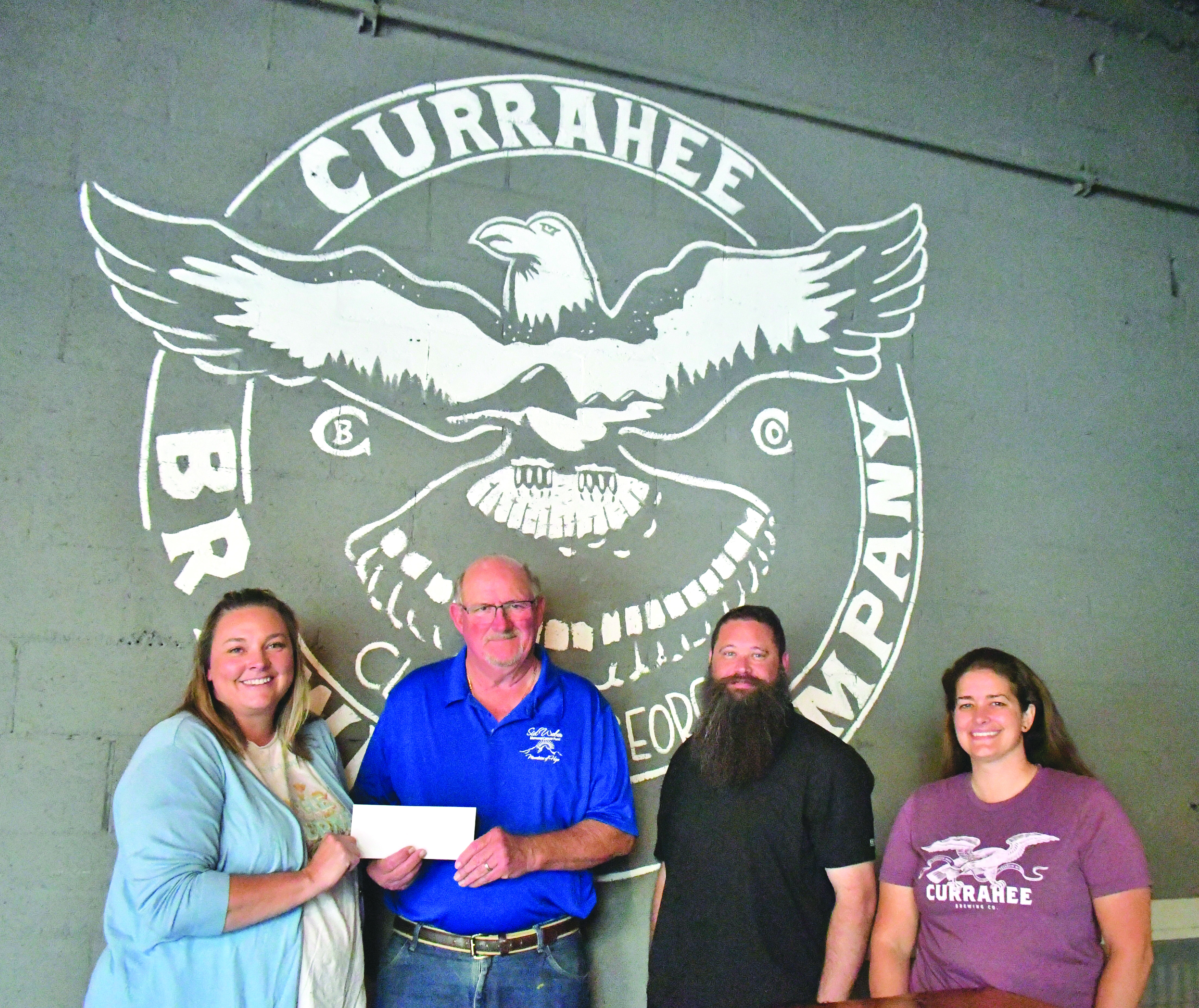 Megan Broome/The Clayton Tribune. Nonprofit night at Currahee Brewing Company raised $4,100 for Sid Weber Memorial Cancer Fund. Pictured are Ara Joyce (left); Sid Weber Memorial Cancer Fund President Ken Walton; Scott Mazarky; and Hillary Marshall. 