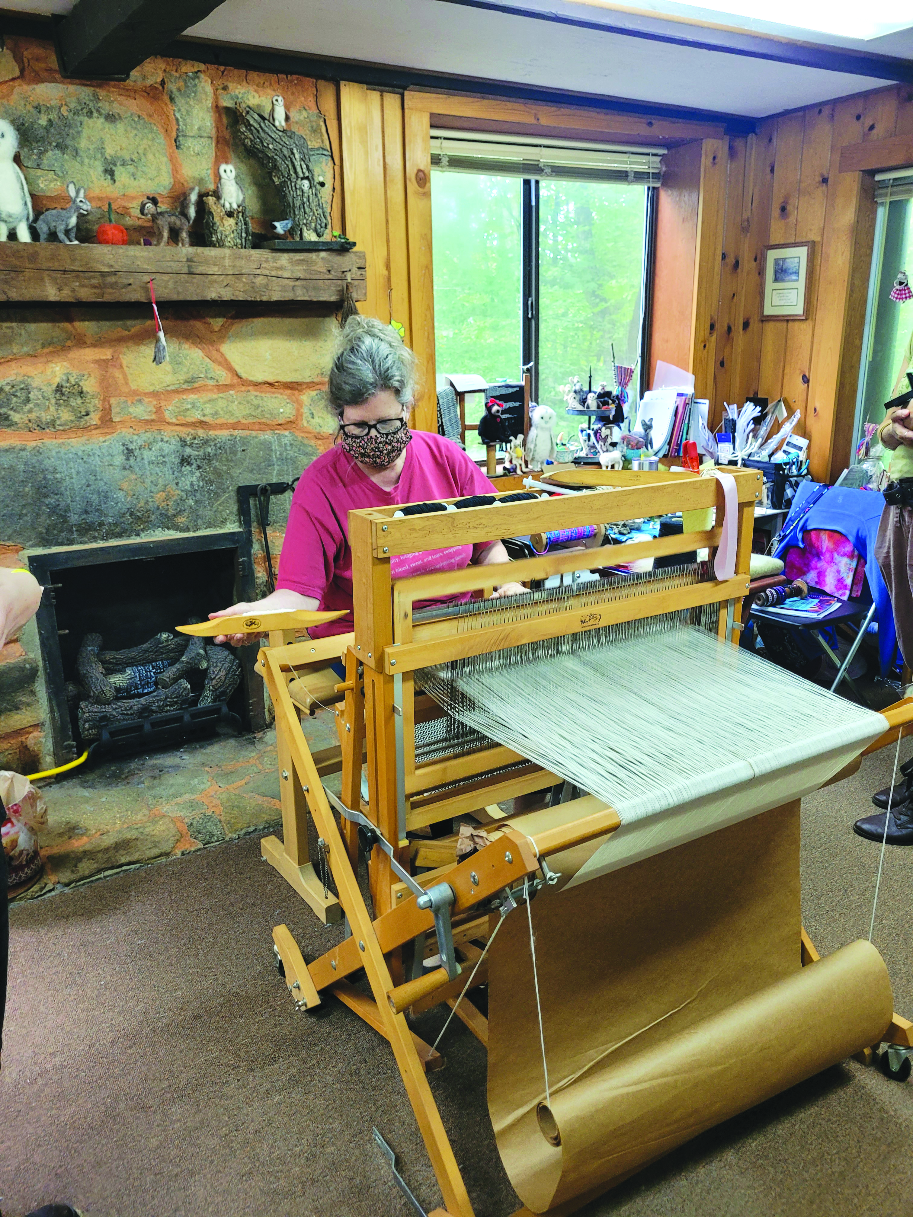 File photo/Megan Broome/The Clayton Tribune. Foxfire’s Kelly Coldren, fiber artist, demonstrates weaving at the Foxfire Museum in 2022. 