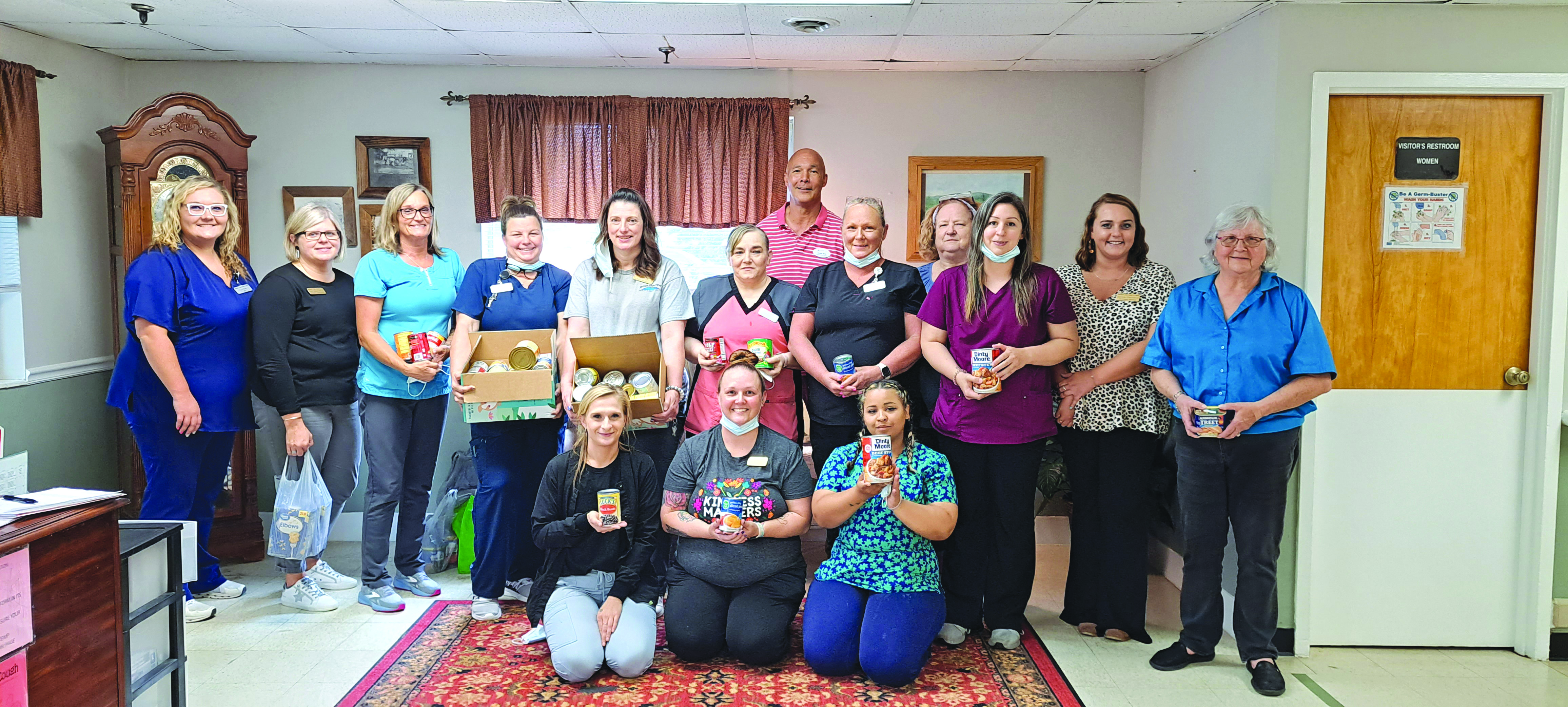 Megan Broome/The Clayton Tribune. Workers at Mountain View Health and Rehabilitation Center in Clayton donate 169 pounds of food to the Food Bank of Northeast Georgia to give back to the community during National Skilled Nursing Care Week. 