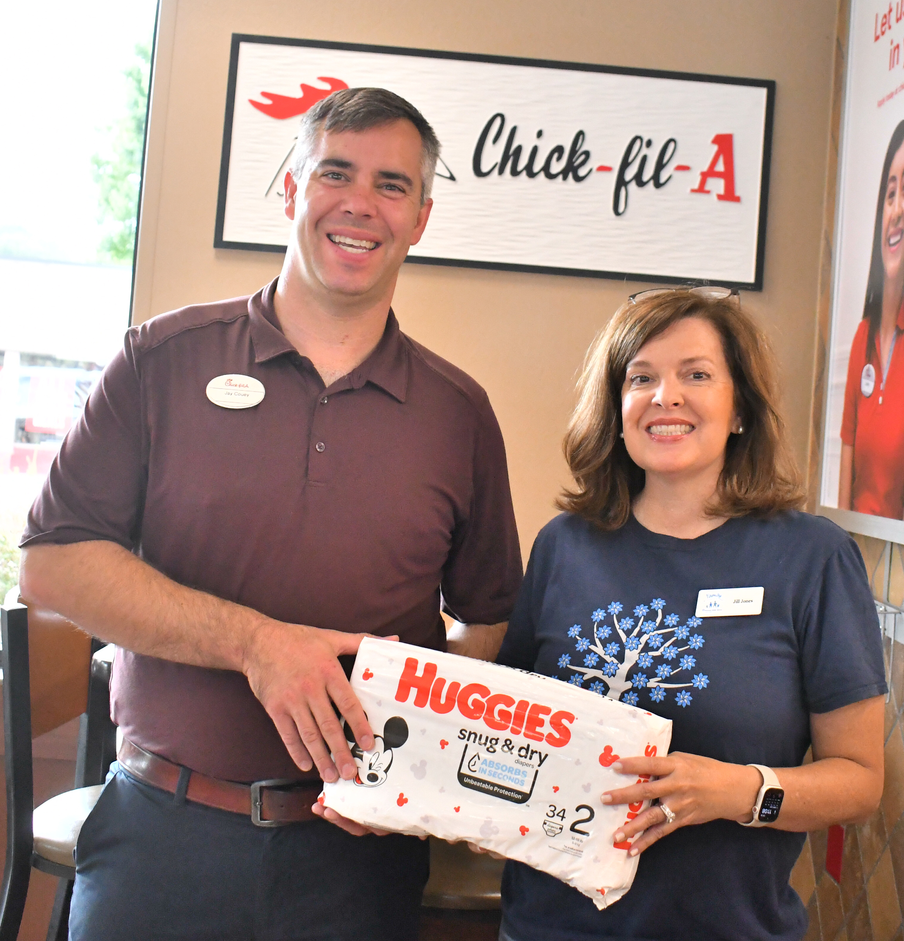 Megan Horn/The Clayton Tribune. Family Resource Center of Northeast Georgia and Chick-fil-A in Clayton are partnering for a Diaper Drive Monday, Sept. 11, to Saturday, Sept. 23. During that time, community members can drop off diapers in the container located in the lobby of the restaurant. Pictured are Jay Couey, owner/operator Chick-fil-A Clayton, and Jill Jones, Rabun County’s representative for Family Resource Center of Northeast Georgia, who have partnered for a local Diaper Drive.
