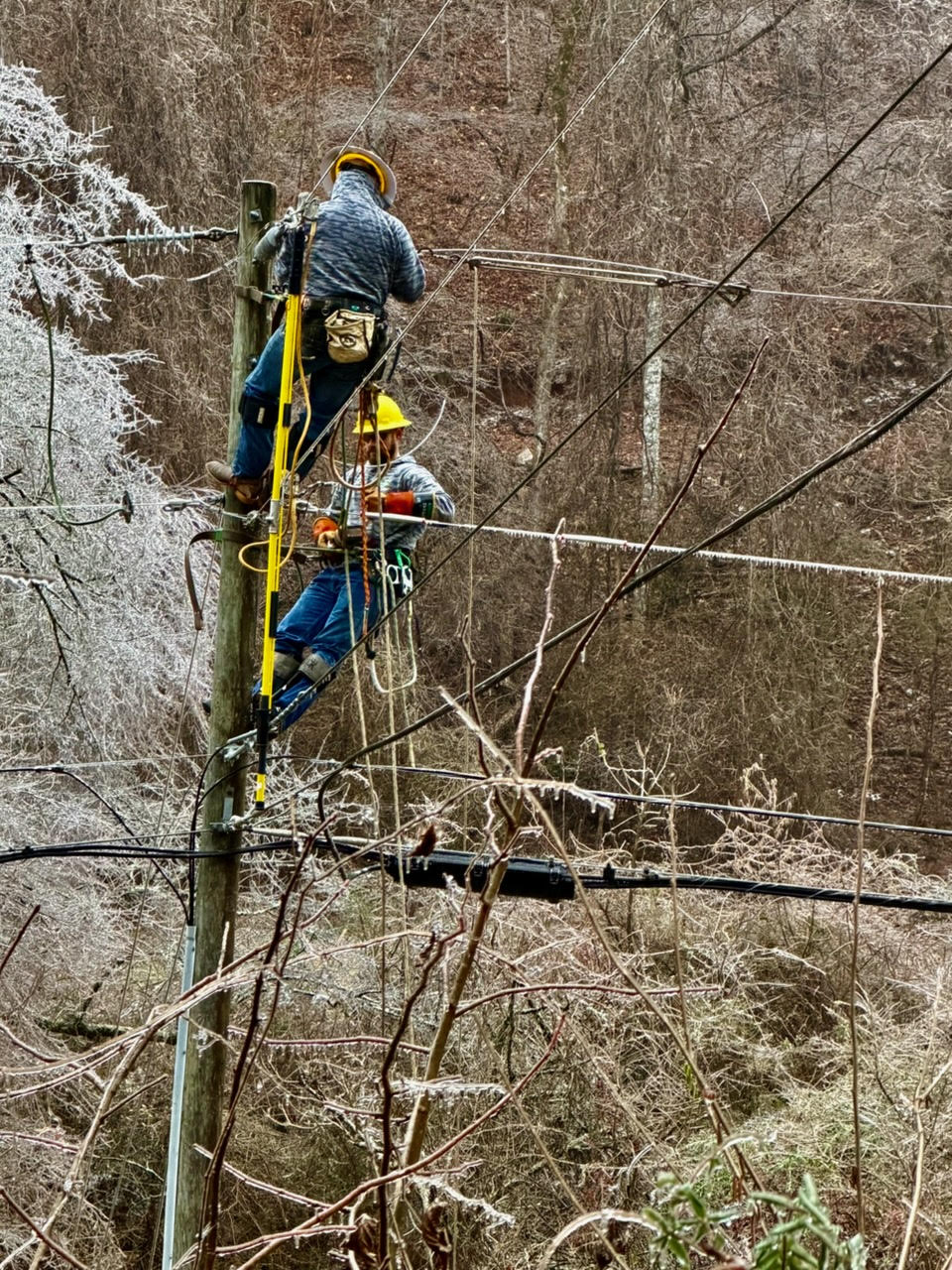 Photo courtesy of Mark Holloway. Linemen worked around the clock during Winter Storm Fern to restore power to residents in surrounding areas and Rabun County. These lineman were seen working on Rickman Airfield Road. EMA Director Brian Panell said that at the peak of the storm, nearly 72 percent of the county was without power. 