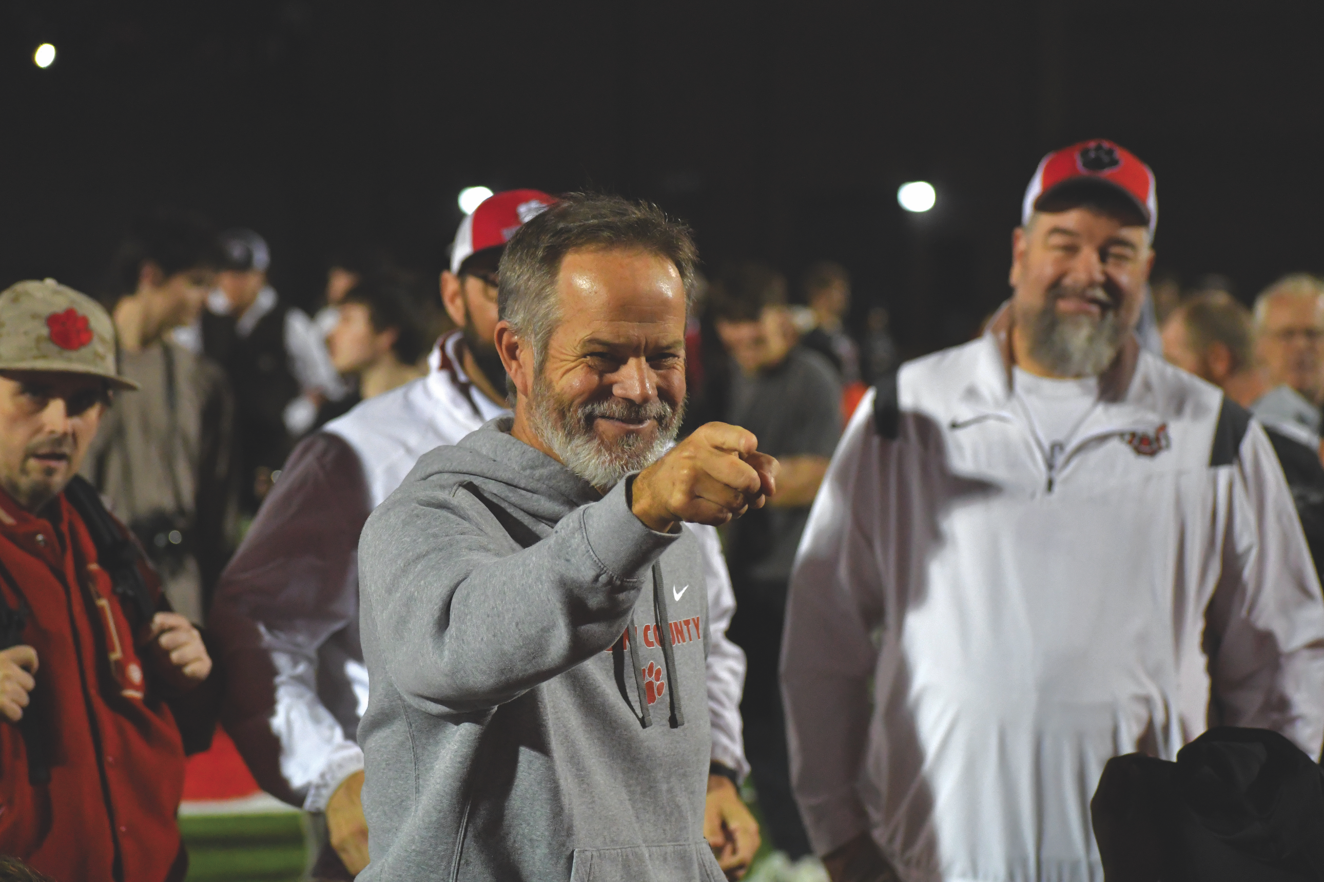 Wesley Branch/The Clayton Tribune. Rabun County head football coach Rance Gillespie celebrates with his team after the Wildcats’ 35-0 second-round playoff win over Berrien on Nov. 21, 2025. Gillespie and the Wildcats have celebrated each win at home with the song “It’s a Great Day to Be Alive,” since former head coach Lee Shaw started the tradition in 2013. Standing in the background are Manager Josh Justus, Pastor Lance Courtney and current Rabun County Athletics Booster Club President Joey Haban.