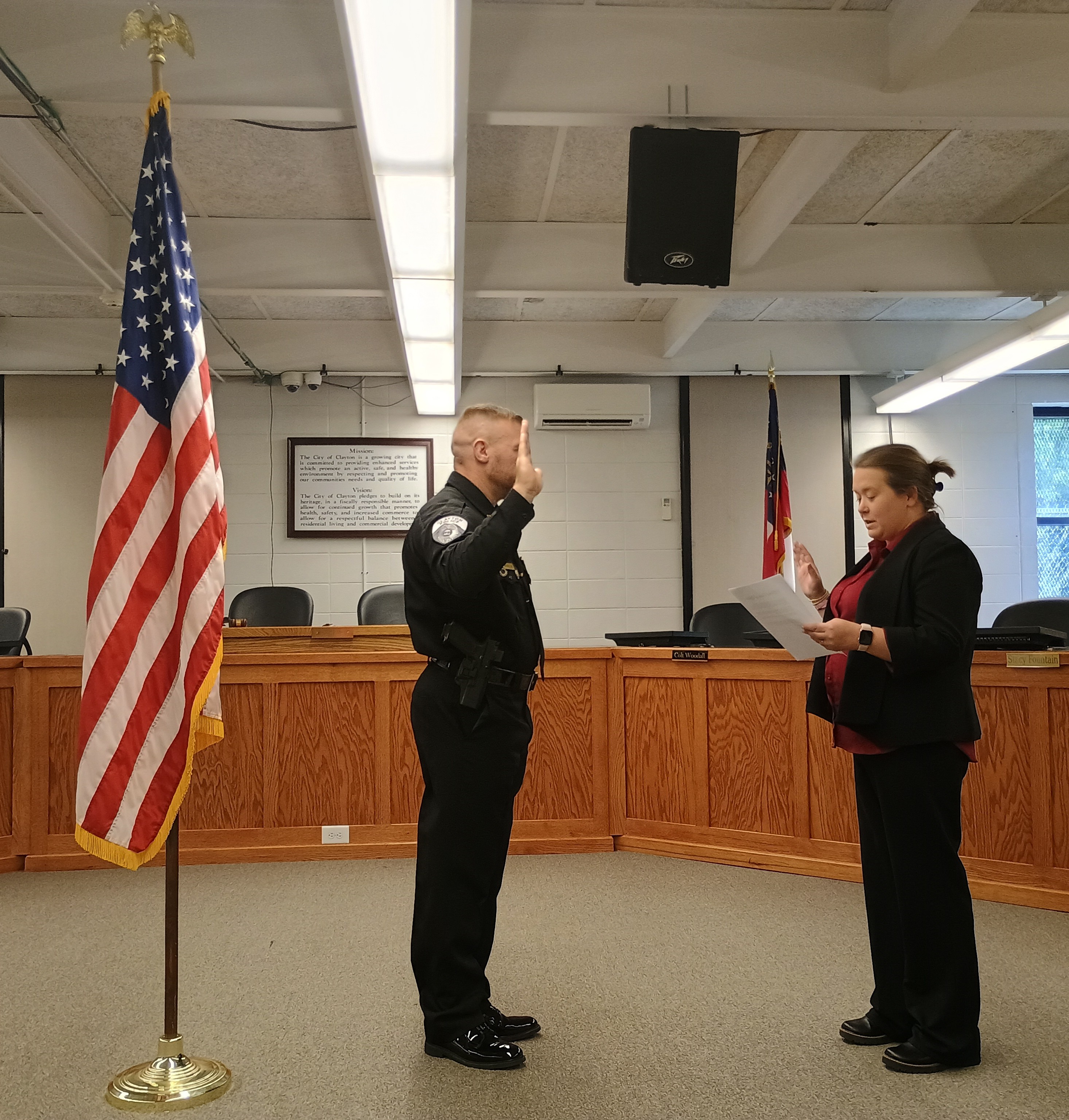 Megan Horn/The Clayton Tribune. Kevin Marsteller, left, take the Oath of Office as Clayton Police Chief, administered by Probate Judge Savannah Dixon, at the Clayton City Hall courtroom Thursday, Aug. 27. 