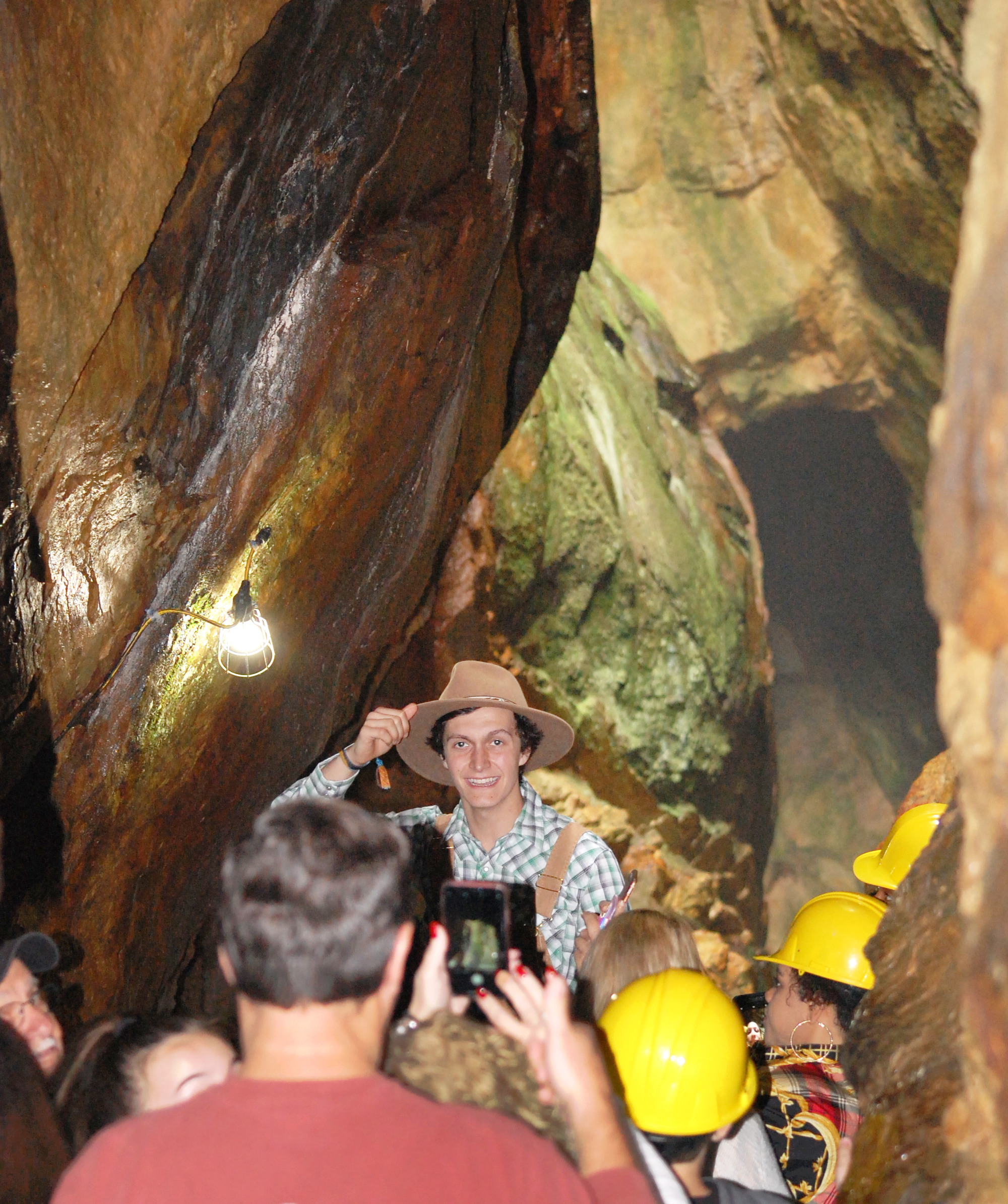 Consolidated Gold Mine tour guide Nolan Atkins shows visitors where a massive vein of gold-bearing quartz once filled the mountain. (Photo/John Bynum)
